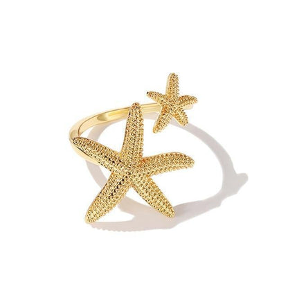 Anillo Ajustable de Plata y Oro con Motivo de Estrella de Mar